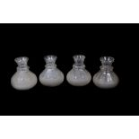Four Victorian carafes, with slice cut necks and collars and conical semi-frosted bodies, with
