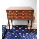 A George IV mahogany enclosed dressing table, the rectangular top with a moulded edge enclosing a