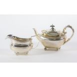 A late Victorian silver teapot, with swollen tapered body and flanged gadrooned border, leaf