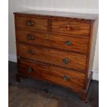 A 19thC mahogany chest, of two short and three long graduated cockbeaded drawers, with brass oval