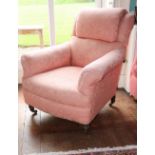 A Victorian mahogany armchair, upholstered in coral damask fabric, on turned legs with ceramic