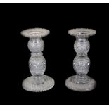 A pair of Regency cut glass candlesticks, with double knopped and ring stems, with hobnail cut