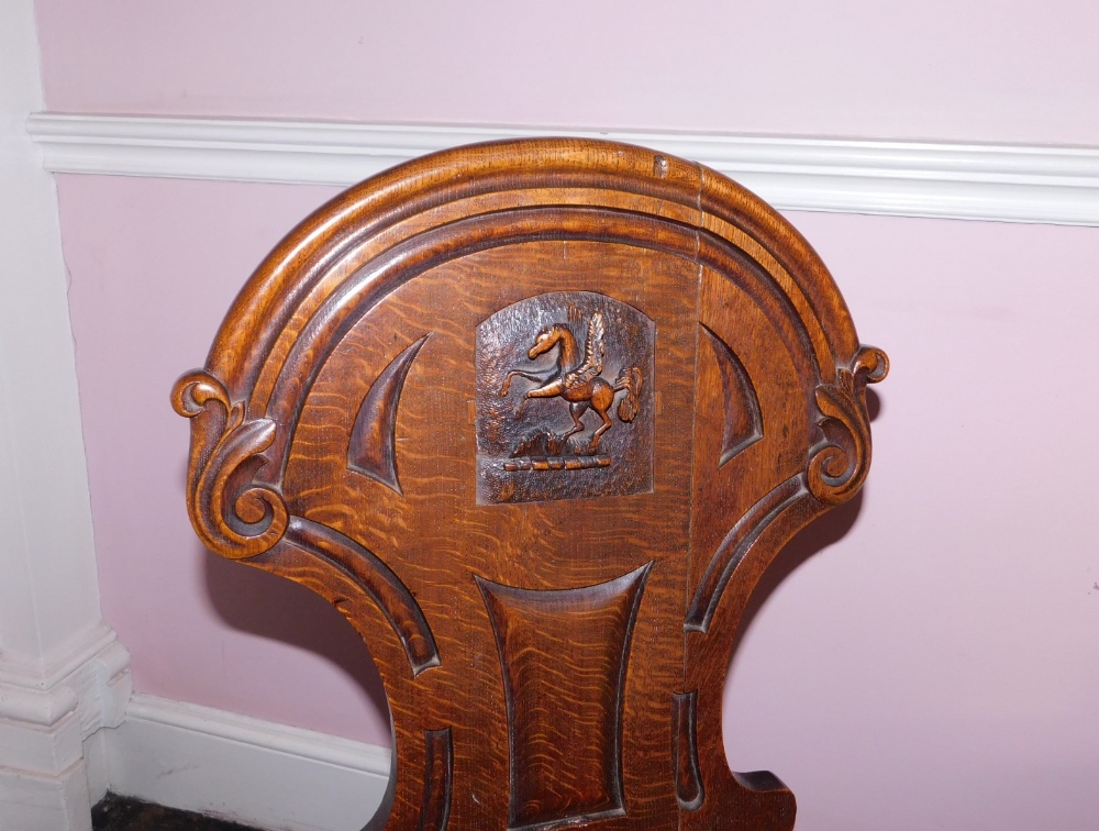 A pair Victorian oak hall chairs, the shield shaped back with carved Pegasus crest, the solid - Image 4 of 5