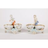 A pair of early 19thC KPM Royal Berlin porcelain double salt stands, with putti figures and hand