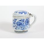 A 18thC Chinese pot and cover, of cylindrical form with blue and white floral decoration, 9cm high.