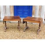 A pair of William IV rosewood sofa tables, each rectangular top with rounded corners above a