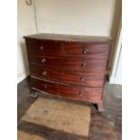 A Regency mahogany bow front chest, of two short and three long drawers with some knob handles and