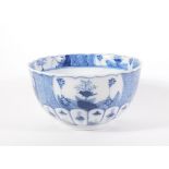 A 19thC blue and white porcelain bowl, moulded and decorated in the Chinese style and having cross