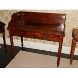 A Victorian mahogany washstand in the manner of Holland & Son, the raised gallery with corner