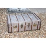 A metal and wooden bound canvas cabin trunk, with brassed mounts, leather side handles, 36cm high,