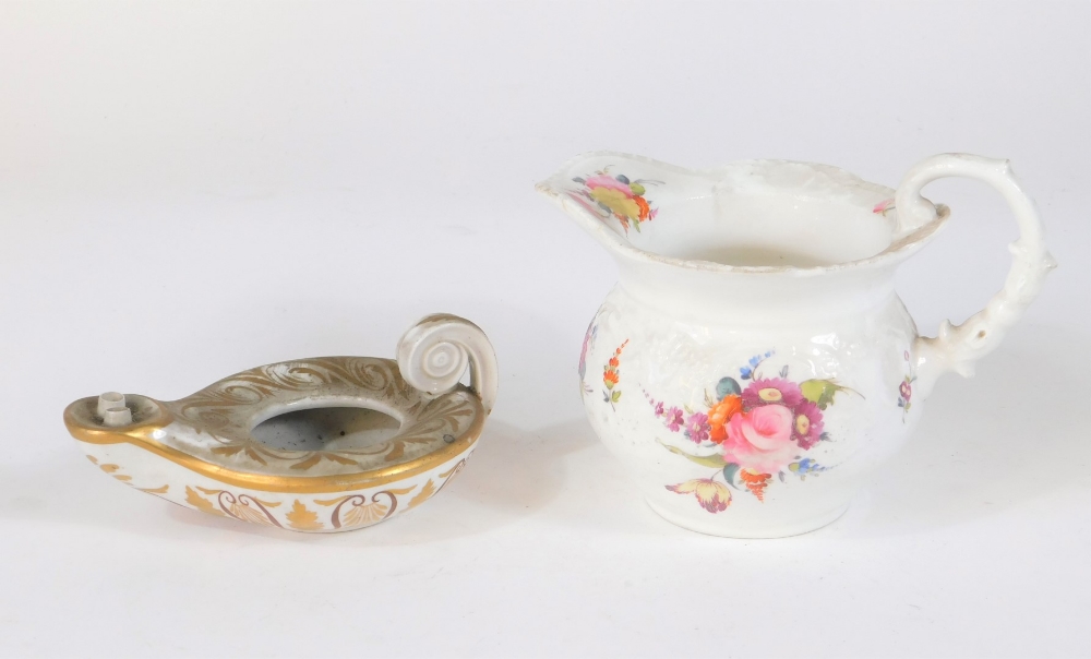 A Coalport felspar cream jug, decorated with floral sprays on a C scroll moulded body and 12cm