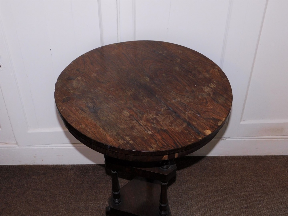 A early Victorian rosewood washstand, the circular top above two triangle undertiers, each with - Image 2 of 2