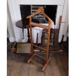 A 19thC mahogany tripod table, two dressing table mirrors, oak fender and valet stand. (quantity)
