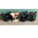 Four various Victorian pottery cow creamers.