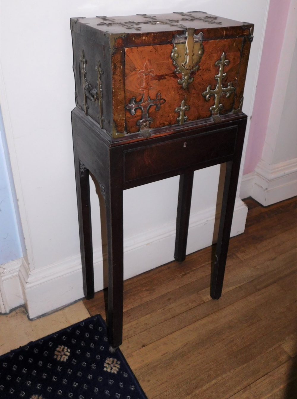 A French 17thC Kingwood Coffre Forte, with brass Gothic style straps, the hinged lid enclosing a