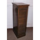 An early 20thC Lebus oak filing cabinet, the top with a moulded cornice above a tambour door
