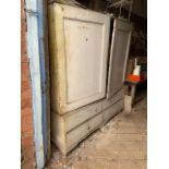 A 19thC housekeepers painted pine linen press and cabinet, with two doors over an arrangement of