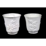 A pair of 19thC Chinese blanc de chine libation cups, 7.5cm high. (AF)