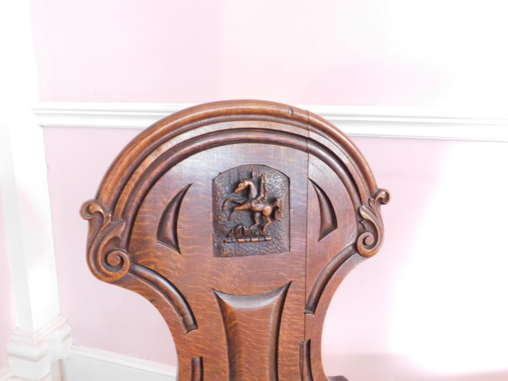 A pair Victorian oak hall chairs, the shield shaped back with carved Pegasus crest, the solid - Image 5 of 5
