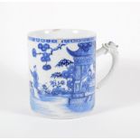 An early 19thC Chinese blue and white porcelain pallet mug, handpainted with landscape, boats,