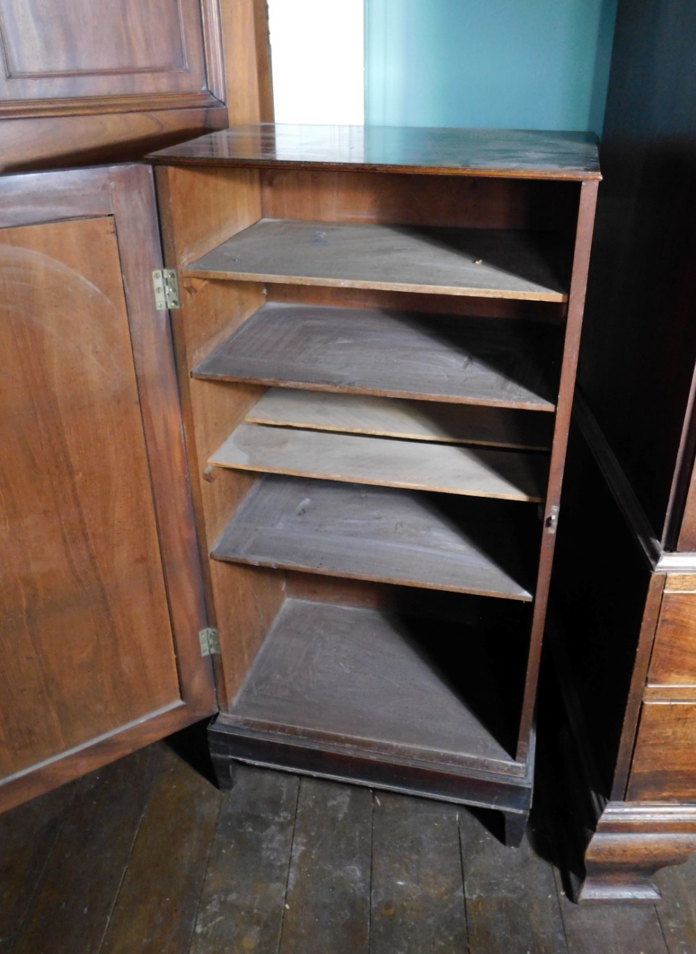 An early 19thC mahogany folio cabinet, the top with a moulded edge and a single panelled door - Image 2 of 2