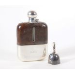 A George IV leather bound glass hip flask (3/8 pint), with silver bayonet cap and cup, initialled
