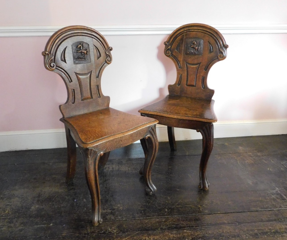 A pair Victorian oak hall chairs, the shield shaped back with carved Pegasus crest, the solid - Image 3 of 5