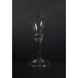 An 18thC wine glass, with bell shaped bowl and double air twist stem on a folded foot, 17cm high.