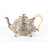 A William IV silver teapot, of circular bombe form, the domed hinged lid with a flower head knop,