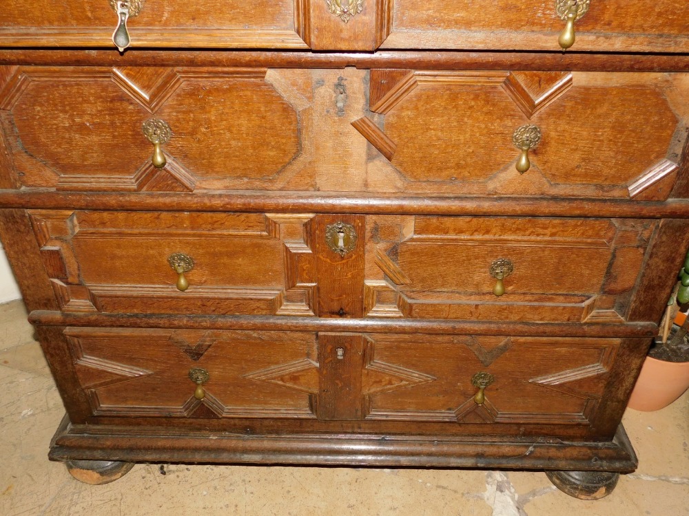 A late 17th/early 18thC oak chest of drawers, the planked top with a moulded edge, above four - Image 3 of 3