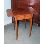 A Victorian mahogany Pembroke table, the rectangular top above an ebony strung frieze drawer, on