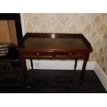 A early Victorian mahogany washstand, with a raised gallery above two frieze drawers, each with