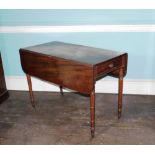 An early Victorian mahogany Pembroke table, the top with rounded corners above a frieze drawer