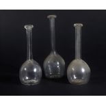 Three 19thC glass toddy lifters, including two of similar design with faceted finger stop