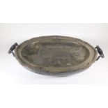 A Victorian oval silver plated hot water meat dish, with shaped gadrooned border and turned ebony