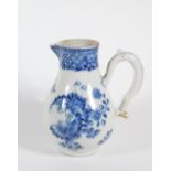 An early 19thC Chinese blue and white porcelain milk jug, with loop handle and sparrow beak spout,