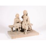 A Victorian bisque stoneware figure group, of two young country girls sitting on a bench, the