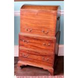 An early 19thC dome top mahogany chest, with brass handles and a frieze drawer, on a two drawer base