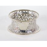 A George V silver potato dish ring, of circular pierced design engraved with a lion, hare, birds,