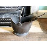 A Victorian copper coal helmet, 45cm.