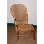 An Edwardian beech stool, with cane top and later peacock chair. (2)