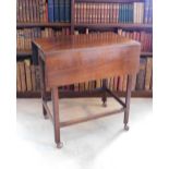 An early 19thC mahogany Pembroke table, with a plain planked top above a frieze drawer on
