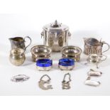 A silver plated oval tea canister, with lions ring handles, a pair of small silver plated