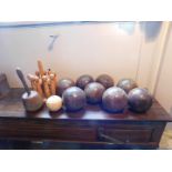 Eight antique lignum bowls, an antique ivory Jack ball, a turned wooden mallet, and a set of table