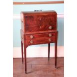 An early 19thC mahogany chest, the domed rosewood crossbanded top, with a brass handle, enclosing