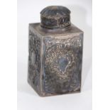 A Victorian silver tea canister, of square section design, decorated with repousse cartouche, scroll