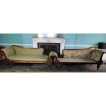 A fine pair of George IV rosewood chaise longues, each with a part show frame upholstered in green