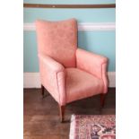 A Edwardian mahogany armchair, upholstered in coral damask fabric on square tapering legs with