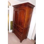 A Victorian mahogany linen press, with moulded cornice, two arch doors revealing press drawers