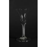 An 18thC wine glass, with bell shaped bowl and air twist stem on a folded foot, 18.8cm high.